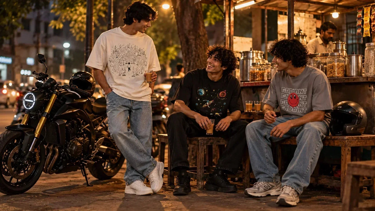 Men styling oversized graphic T-shirts with straight, black and relaxed-fit jeans