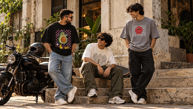Men wearing oversized graphic T-shirts in modern everyday streetwear outfits